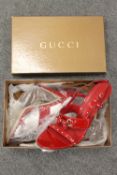A pair of Gucci Italian red leather shoes, size 40.5, un-worn, with retail packaging and box.
