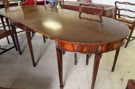 A nineteenth century style extending D-end mahogany dining table with two leaves,