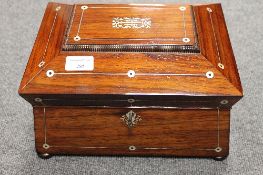 A Victoria rosewood casket, inlaid with mother of pearl, with gilt brass handles, width 29.5 cm.