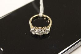A three stone diamond ring, approximately 1.5ct. CONDITION REPORT: Yellow metal tested as 18ct. Good