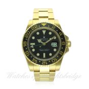 A GENTLEMAN'S 18K SOLID GOLD ROLEX OYSTER PERPETUAL GMT MASTER II BRACELET WATCH CIRCA 2010, REF.