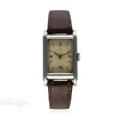 A GENTLEMAN'S STAINLESS STEEL OMEGA WATERPROOF WRIST WATCH CIRCA 1939
D: Silver dial with black