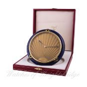 A RARE GILT METAL & LACQUERED CARTIER DESK CLOCK WITH ORIGINAL BOX AND PAPERS DATED 1991
D: Gold