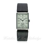A GENTLEMAN'S STAINLESS STEEL RECTANGULAR IWC WRIST WATCH CIRCA 1940s
D: Silver dial with Arabic