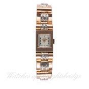 A LADIES SOLID GOLD & DIAMOND GIRARD PERREGAUX BRACELET WATCH CIRCA 1950s D: Two tone silver dial