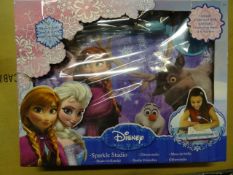 1 x Disney Frozen Sparkle Studio. Contains: 1 x Cushioned desk with light, 6 x Colouring sheets