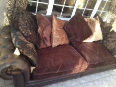 4 seater settee with scatter cushions and leather studded arms, in good condition