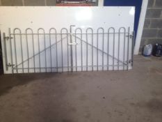 Pair of bow top metal gates complete with hinges, drop bolt and latch