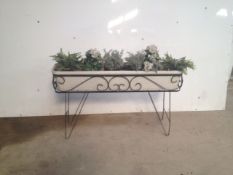 Decorative plants on metal stand