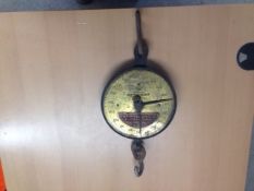 This auction lot is an antique Brass faced set of large weighing scales (up to 240 KGS)