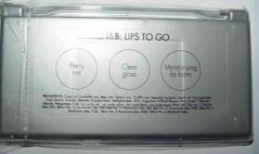 CIRCA 60 LIP GLOSS TRAYS WITH 2 LIP COLOURS BERRY TINT CLEAR GLOSS AND 1   MOISTURISING LIP BALM