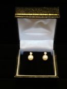 1  x Pair of 9 Carat White gold pearl and diamond stud earrings. Total RRP £129. Beautiful elegant
