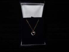 1 x 9 Carat Yellow Gold 18 Inch Curb Chain and Heart Shaped Pendant. Comprising of 5 x 0.5mm Round