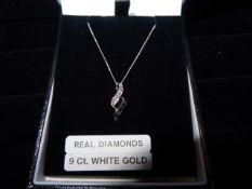 1 x 9 Carat White Gold Chain and Pendant with Black and White Diamonds. Original Manufacturers