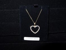 1 x 9 Carat Yellow Gold Chain and  Cubic Zirconia Heart Pendant. Brand new and Boxed! Original