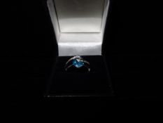 1 x 9 Carat White Gold Blue Topaz and Diamond Ring. Size L. Beautiful stand out piece! Brand new and
