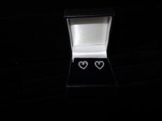 1 x Pair of 9 Carat White Gold Diamond Heart Stud Earrings. Origional manufacturers RRP £125!