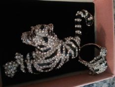 Ring and large brooch set with Swarowsky elements, stunning.