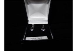 1 x Pair of 9 Carat White Gold and Cubic Ziconia Eifel tower style earrings. Brand new and Boxed.