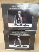 2 x Wine Aerator sets. Each includes: Aerator, tower and base, stopper, aerator stand and travel