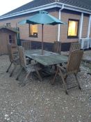 Patio table and chairs with parasol