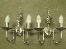 pair of ornate silver wall lights