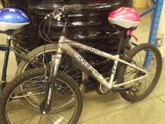 his n hers pair of used blade mountain bikes complete with helmets