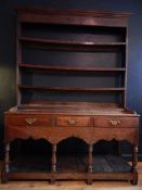 GEORGE II PERIOD MONTGOMERYSHIRE OAK DRESSER CIRCA 1750. Condition: Fine Patination, old repair to
