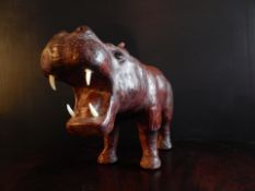 LEATHER HIPPO FOOTSTOOL ATTRIBUTABLE TO LIBERTY LONDON. Condition: Fine Dimensions: 19″ long 10″