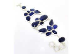 18 Mixed Cut Blue Sapphire and Silver Bracelet.157.41CT. Appraisal Value $11,924.00 approx £7,838.52