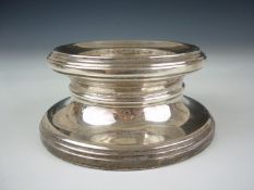 A Late 20th Century silver candle holder or 
stand. 12 cms x 5 cms base loaded