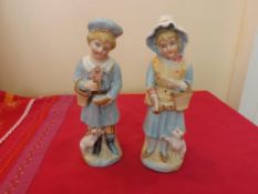 Victorian Bisque Figural Group.  Young
boy and girl. 6 inches tall.  Circa 1880.