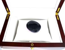 A 386.40 carat Oval Midnight Blue Sapphire Gemstone. Appraised by experienced graduate