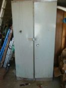 metal storage cupboard with contents