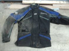 appears dusty blue motor bike jacket - size l