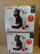 2 x AEG Lavazza AMODO MIO LM3100-U. •Features thermoblock technology & uses Lavazza coffee pods
•