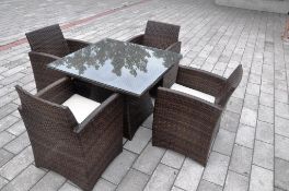 Brown Four Seat Luxury Dining Set. With four large carver chairs and a strong durable tempered glass