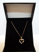 9 Carat Yellow Gold Chain With Diamond Heart Shaped Pendant. Comes With an Independent Insurance