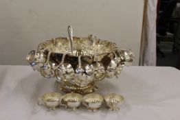 A rare George II style, Hand chase Punch bowl, with an amazing 22 Cups.