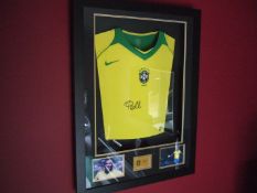 SIGNED PELE SHIRT IN 3D BACKLIT REMOTE CONTROL FRAME.
