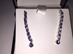 Earrings 
stunning 2.65 carat mixed cut Tanzanite gemstones in a Platinum over silver earings