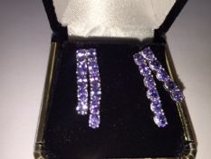 Earrings 
stunning 4.07 carat mixed cut Tanzanite gemstones in Platinum over silver earings