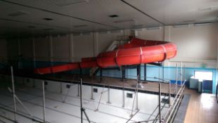 Water slide from a leisure centre.  Red fibreglass sectional construction