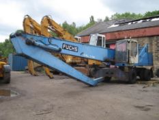 Fuchs 350
1993
30 tonne scrap rehandler with hydraulic high rise cab and solid tyres. The
engine was