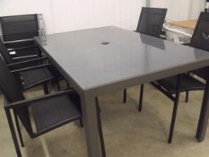 5 Piece Patio Set: 4 x black stacking chairs with textilene seat and back glass top table marble