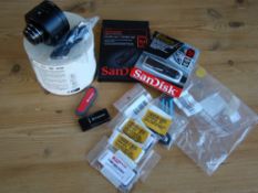 Sandisk and other memory sticks - mixed storage sizes. 1 x sony Q10 lens. Returned items.
