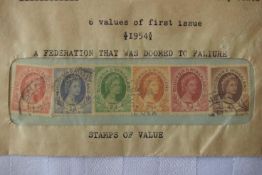 A collection of 6 Rhodesian & Nyasland stamps in a sealed envelope.