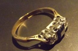 A three stone, saphire and diamond ring, single square cut ring, with two diamonds set to either