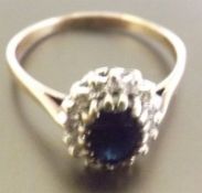 A Saphire and Diamond cluster ring, A stunning Blue Sapphire surrounded by diamonds, set in 9