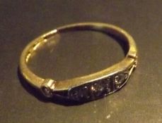 A three stone Diamond trilogy ring, set in 9 carat gold